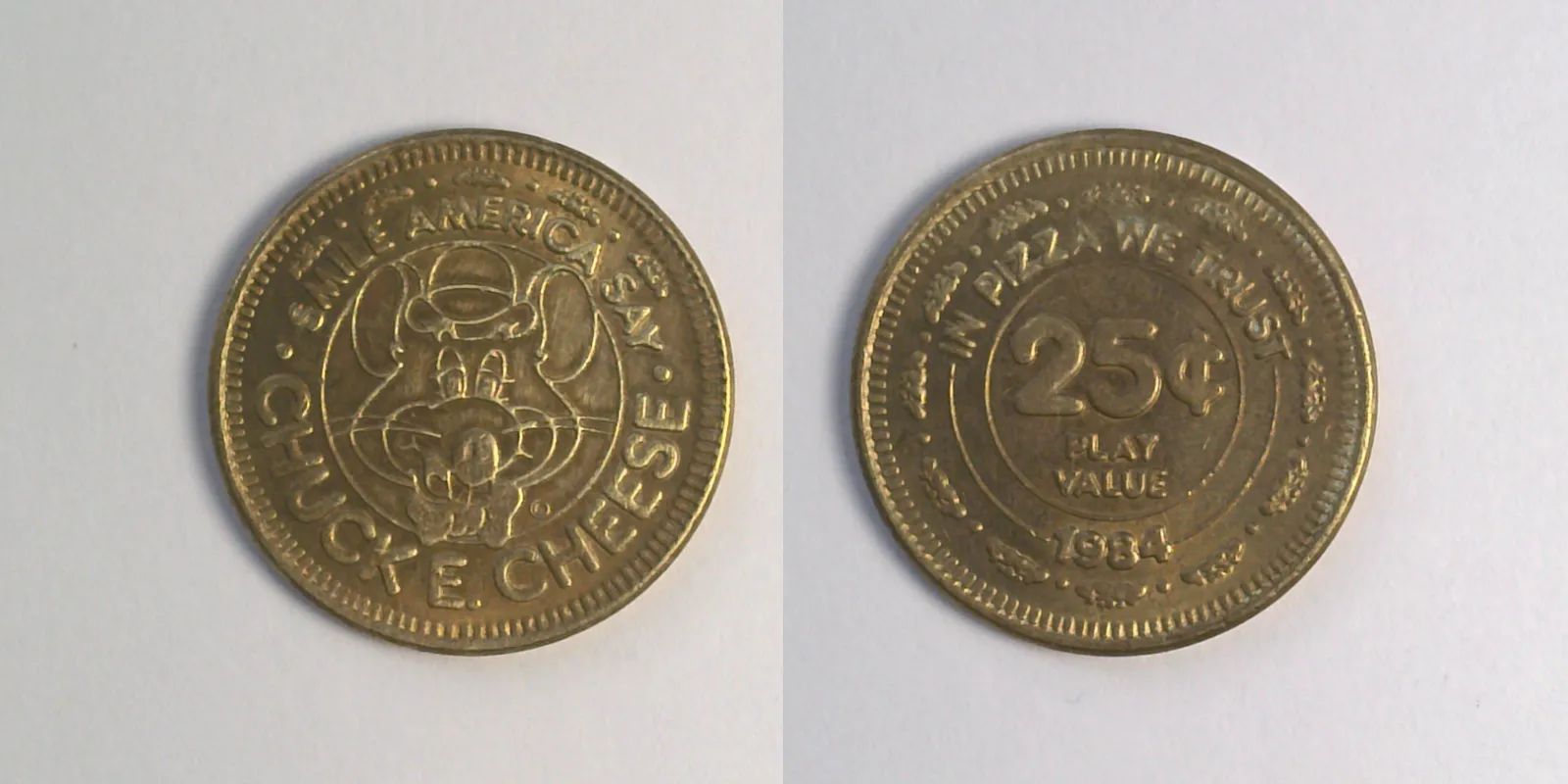 Chuck E. Cheese 217B 1984 Chuck E Cheese Token (217B) (1984) token — front and reverse