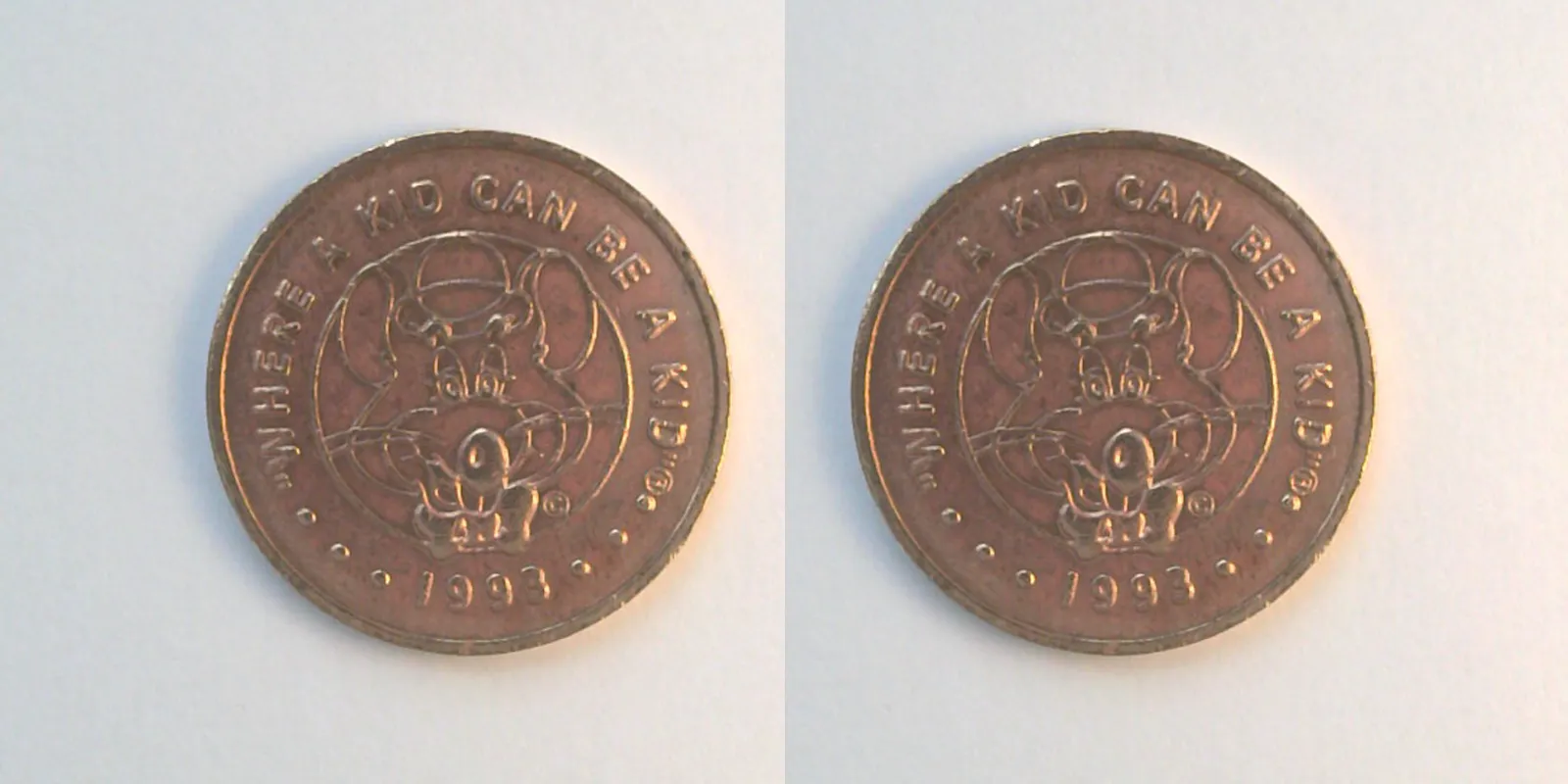Chuck E. Cheese 311C 1993 Chuck E Cheese Token (311C) (1993) token — front and reverse