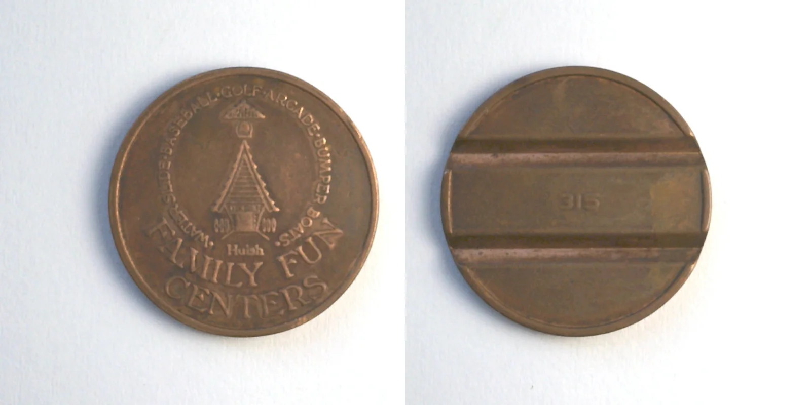 Bullwinkle's Entertainment BW601C Huish Family Fun Centers 315 Token (BW601C) token — front and reverse