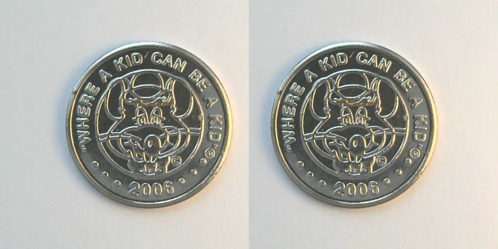 Chuck E. Cheese 328N 2006 Chuck E Cheese Token (328N) (2006) token — front and reverse