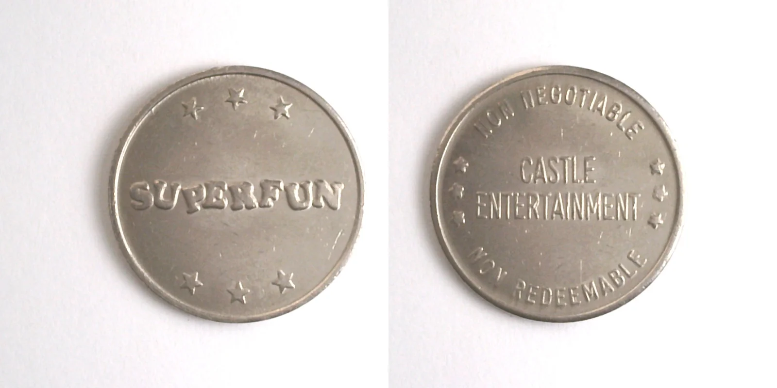 Castle Entertainment CE101N Castle Entertainment Superfun Token (CE101N) token — front and reverse
