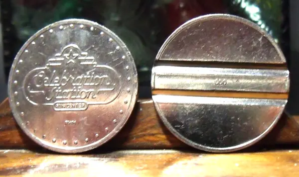 Celebration Station CS101N Grooved Celebration Station Token (CS101N) token — front and reverse